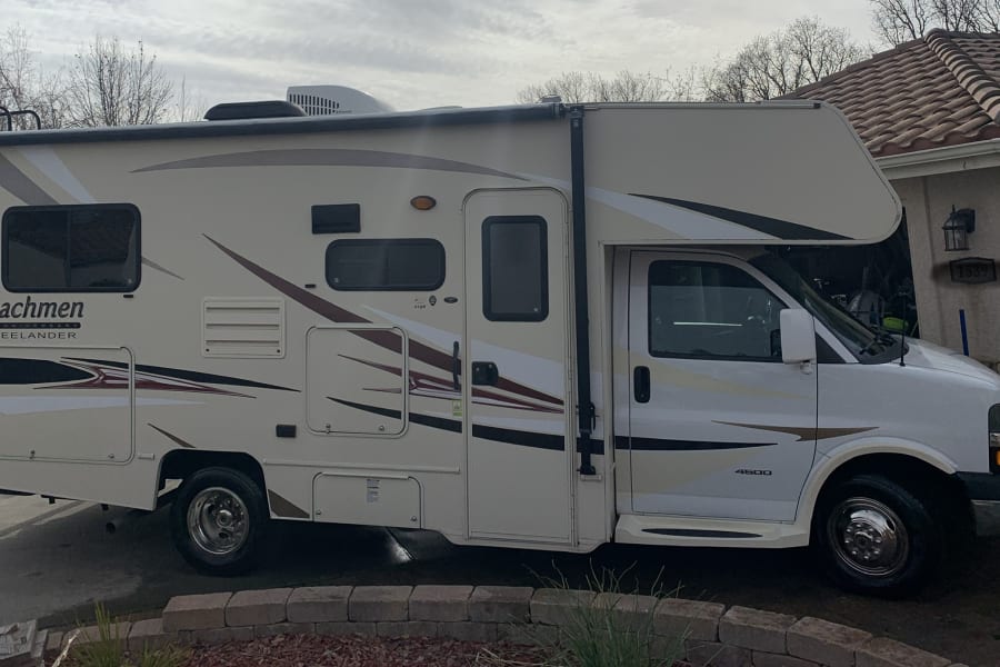 Cream-colored Coachmen Freelander Class C motorhome, great for an rv rental or family travel adventures.