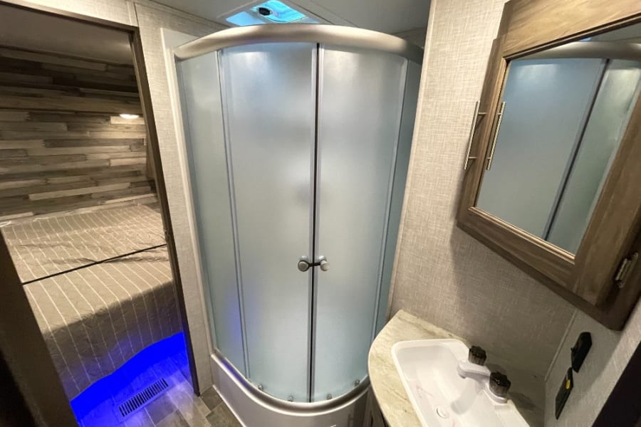 1st bathroom w/shower, sink, and toilet 