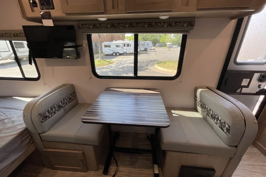 The dinette table serves as a central gathering spot, perfect for enjoying meals, playing games, or planning your next adventure. Its compact yet functional design ensures that you have ample space for dining and socializing.