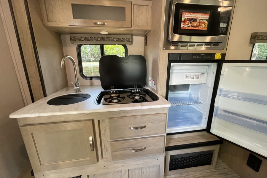 An optimized kitchen with smart design elements for effortless cooking and meal prep during your adventures.