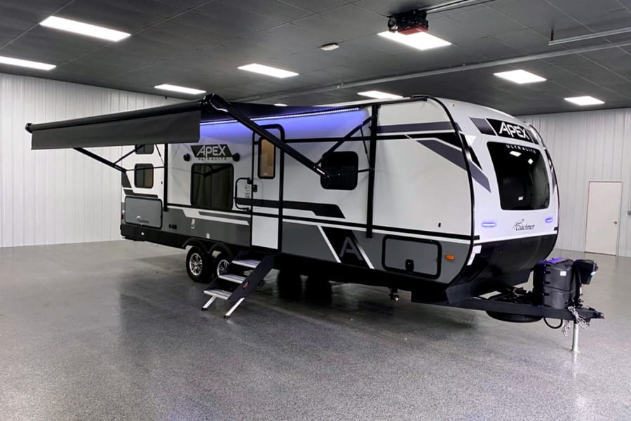 Front door-side quarter view with awning and awning light strip