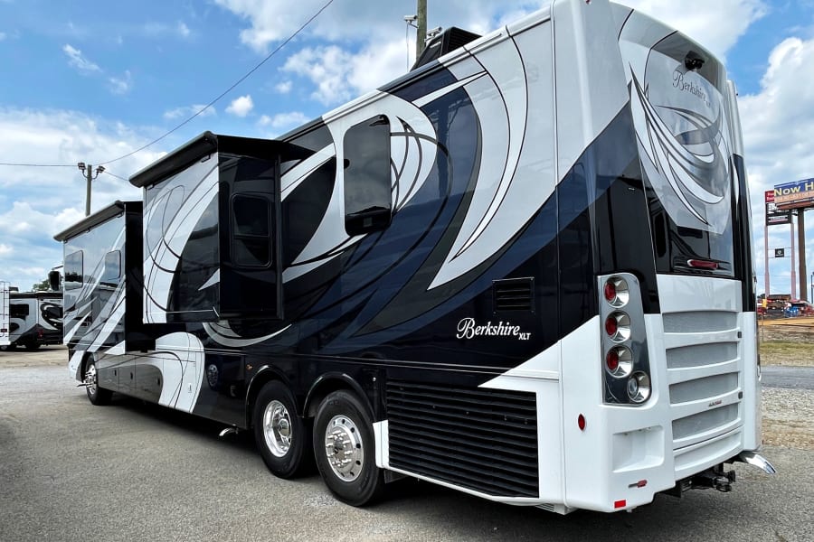 Luxurious black & white Berkshire XLT motorhome for rv rental. Detailed exterior shows sleek design.