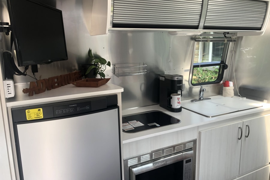 Fridge/freezer combo. Keurig coffee bar.  There&rsquo;s a tv with DVD available. DVD player is WiFi-capable. 