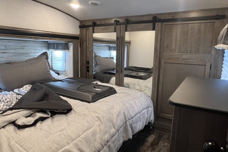 Primary bedroom. Features king size bed.