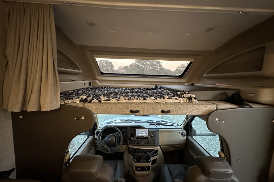 Swivel captains chairs and overhead bunk