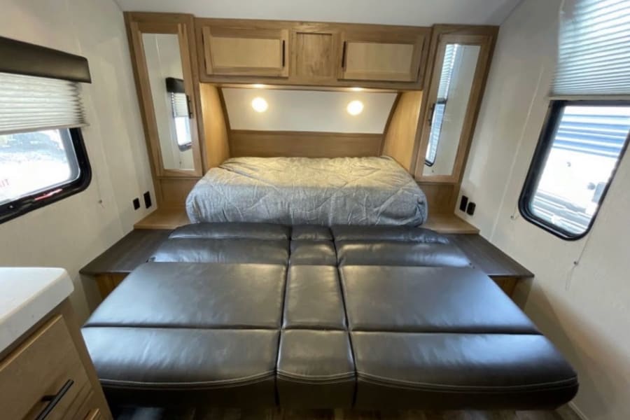 Murphy style Queen bed folds out over couch, super easy conversion.