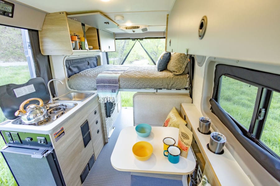 The bed folds up during the day to allow for more space to maneuver about the cabin. 