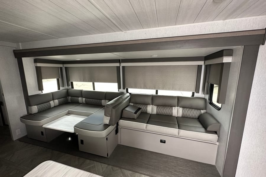 Dinette and sofa. Both convert into sleepers. Each can sleep up to 2 adults. Dinette and sofa can merge into one giant sleeper from one end to the other end.