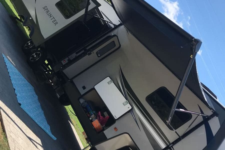 Spacious Sprinter travel trailer, perfect for an RV rental adventure. Ready for your next camping trip!