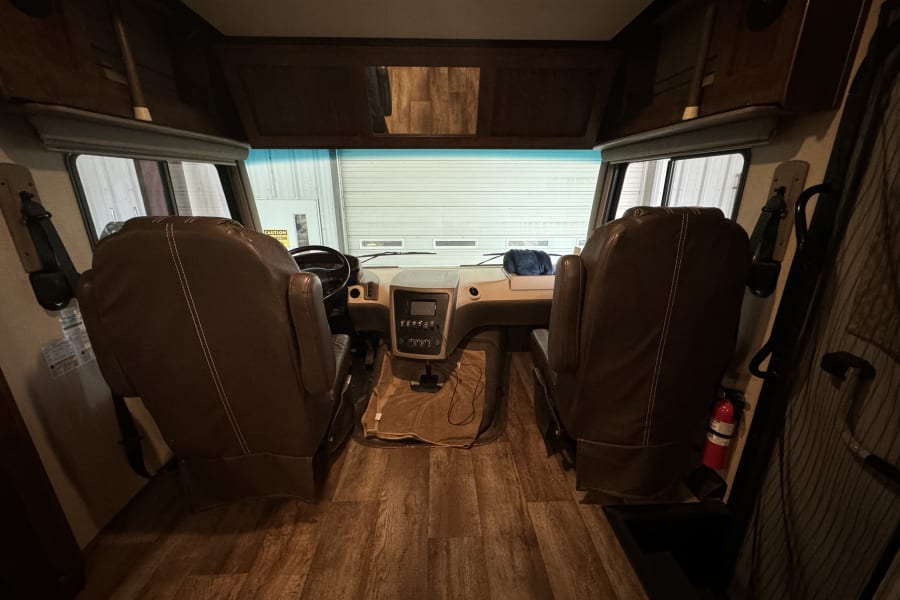Driver and passenger seats with bed up. 