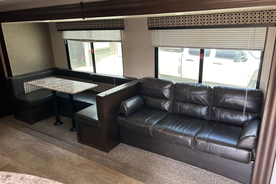 Dinette and couch convert to beds and have built in storage