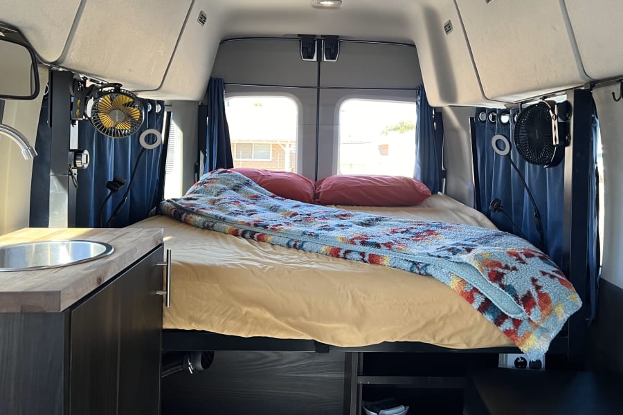 Sleep in this queen memory foam bed, and optionally add sheets, pillows, and fleece blankets for more comfort. (add-ons selected during the booking process)