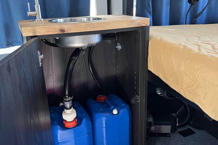 Our vans come equipped with a sink and foot pump system. Plus you'll get 5 gallons of fresh water to wash your hand and brush your teeth. Super easy to operate!
