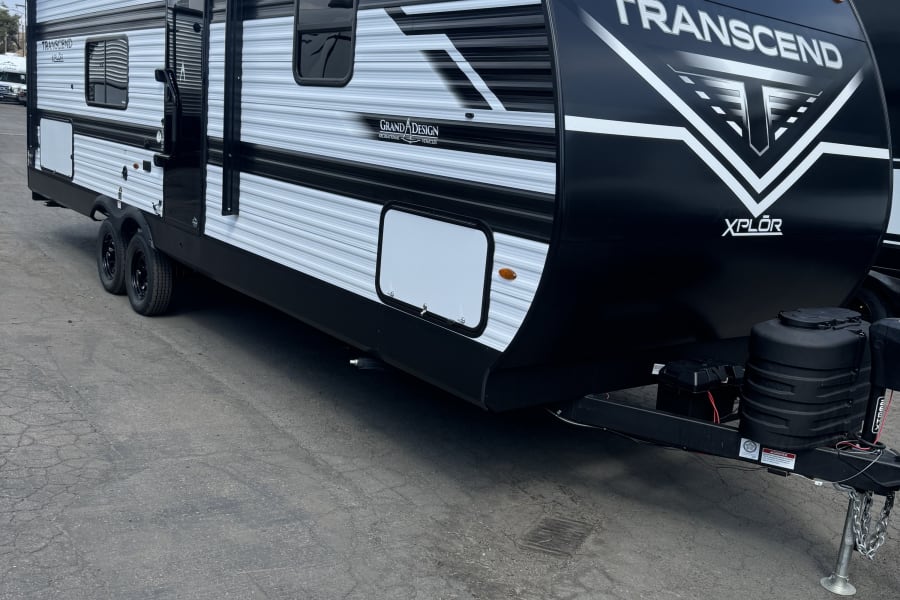 A stylish black & white Grand Design Transcend Xplor travel trailer. Your next RV rental adventure starts here!