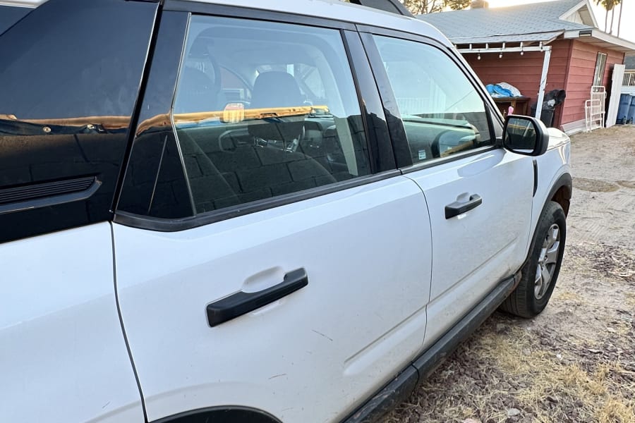 White Ford Bronco Sport with a rooftop tent, great for an rv rental camping adventure.