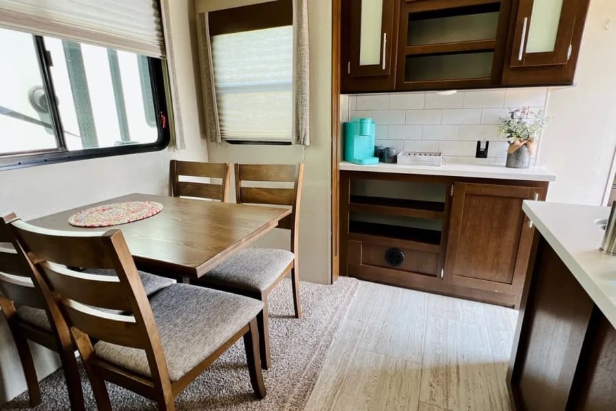 The Impression features a cozy dinette area, perfect for enjoying meals with family and friends.