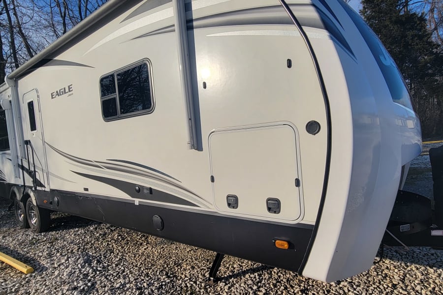 This Eagle Jayco travel trailer RV rental is parked outdoors, ready for your next adventure.