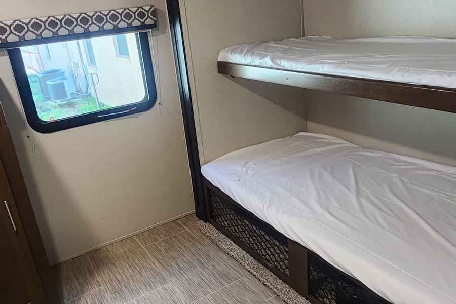 Bunk room will have 4 twin size bunks. This top bunk can be folded up. 