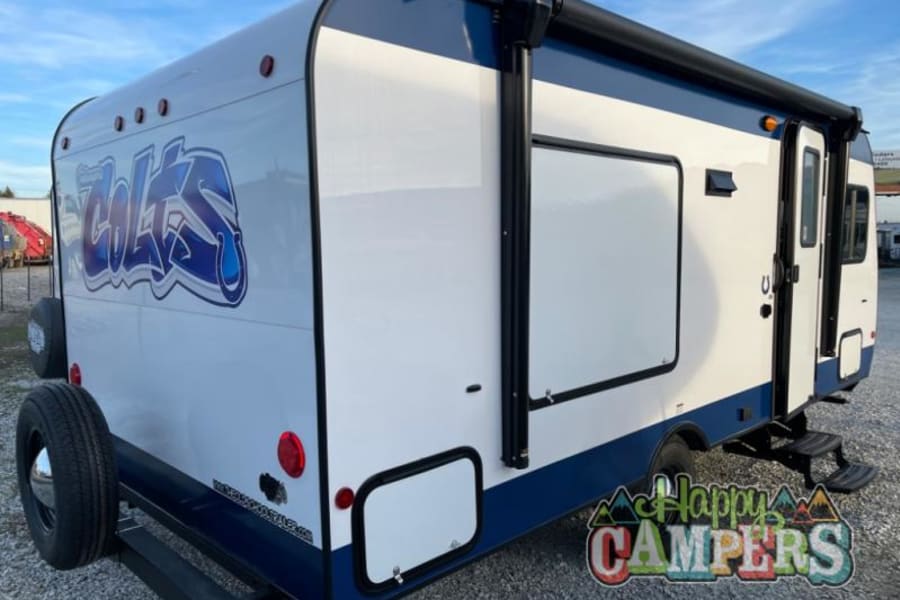 White & blue Colts-themed travel trailer: a unique rv rental for game day or adventure. Fully equipped.