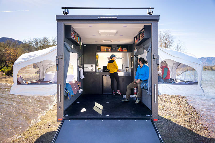 Enjoy spacious RV rental camping by the lake! This versatile rig features pop-out tents for relaxing on the water's edge.