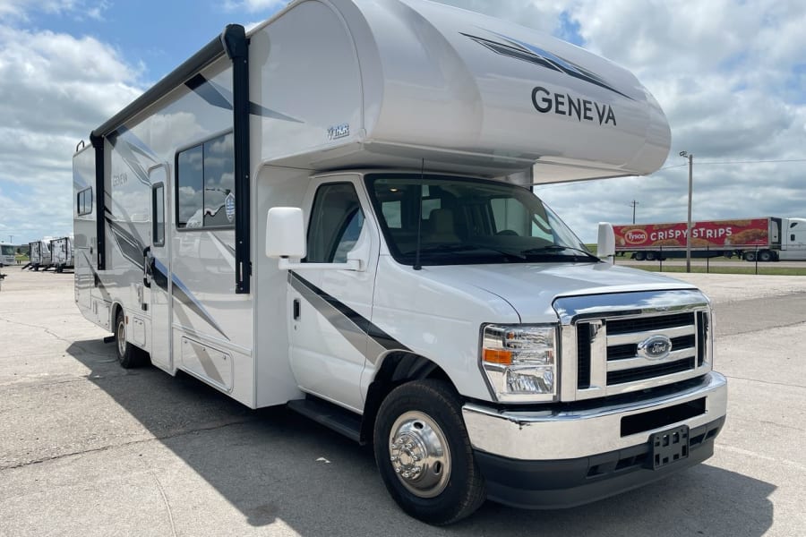 A pristine white Class C motorhome, a perfect rv rental for your road trip dreams.