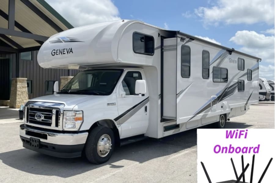 White Geneva Class C RV rental with WiFi onboard, parked outside. Ideal for comfortable travel and connectivity.