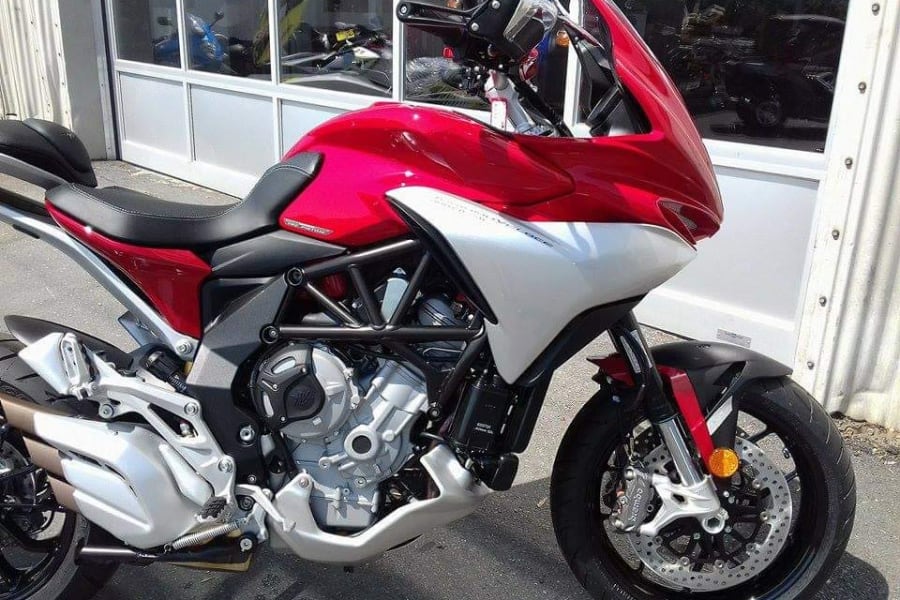 Sleek red and silver touring motorcycle. Perfect for exploring new routes or complementing your next rv rental adventure.