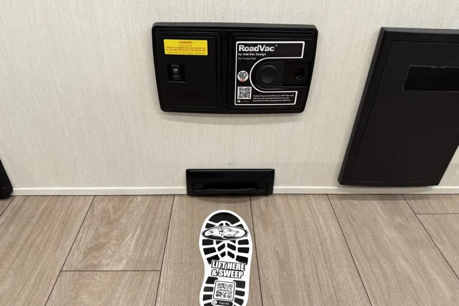 Built-in RoadVac central vacuum with floor sweep inlet, ideal for quick cleanups in an RV rental.