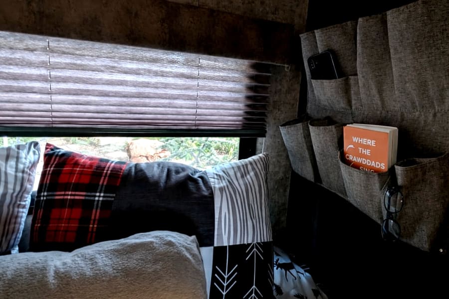 A cozy bed nook - perfect for keeping phones, glasses, books within easy reach.