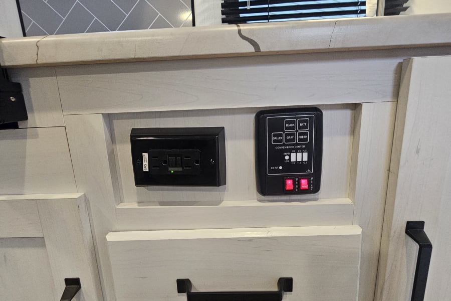 Controls for water heater and water pump. Monitor levels in all holding tanks and battery levels.