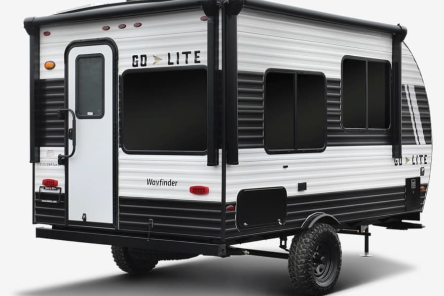 This white and black Go Lite Wayfinder travel trailer is an excellent option for your next rv rental adventure.