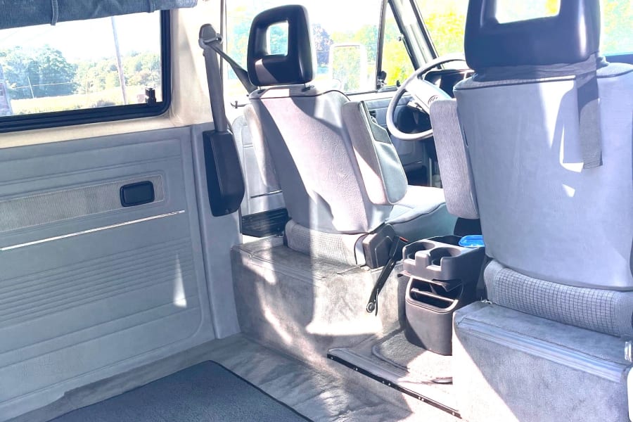 Spacious area behind front seats for gear/hanging out