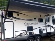 2016 Creek Side  by Outdoors Rv Manufacturing for rent in 97355