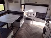 Modern rv rental interior featuring a bright dinette with a