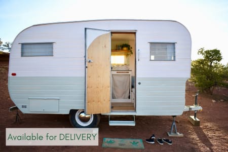 Camp in style- enjoy this vintage camper delivered to your campsite.