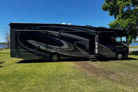 Pet friendly Class A Toy hauler with deck & king size bed.