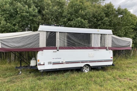 2000 Fleetwood sequoia popup camper parked close to Red Lodge