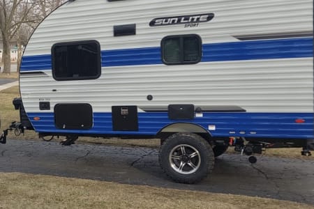 Hit the road in style with our new 2024 Sun Lite 16BH travel trailer!