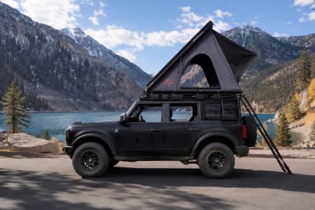 Matte Black Bronco w/ Hard Shell Rooftop Tent & Camping Gear.