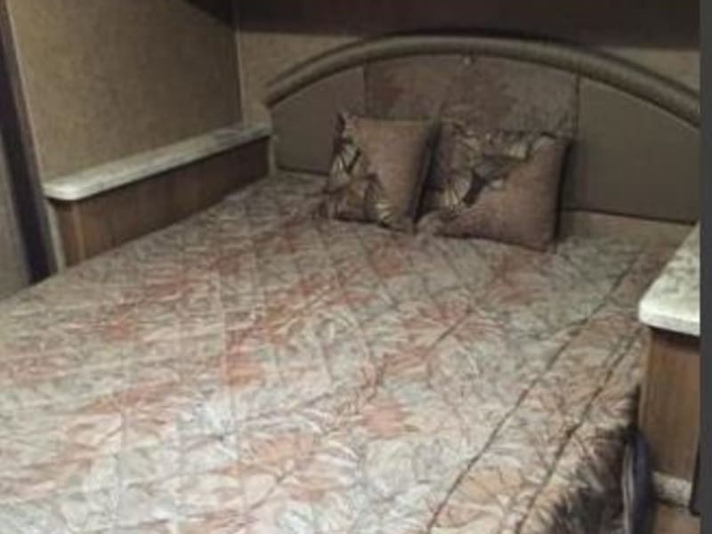 Queen Size bed with comfortable mattress with topper
