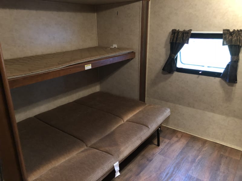 Bunk house-left side. Top bunk and couch folded out into bed. 