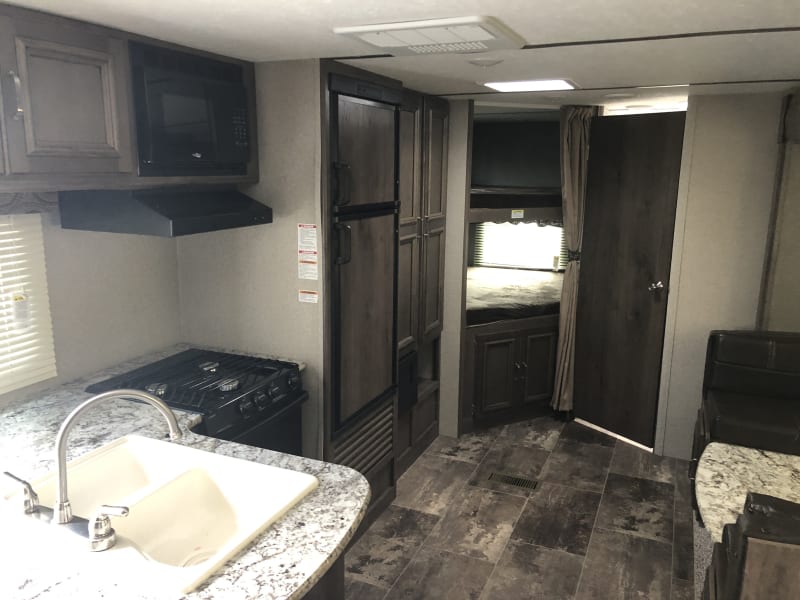 Kitchen and bunks looking from master bedroom