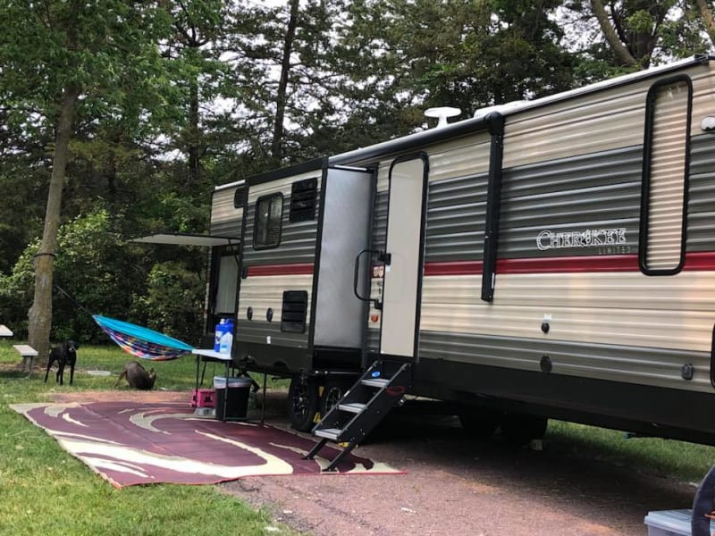 There is a large automatic awning with blue LED lights. 