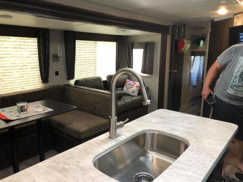 Kitchen island has an extra deep sink and lots of storage