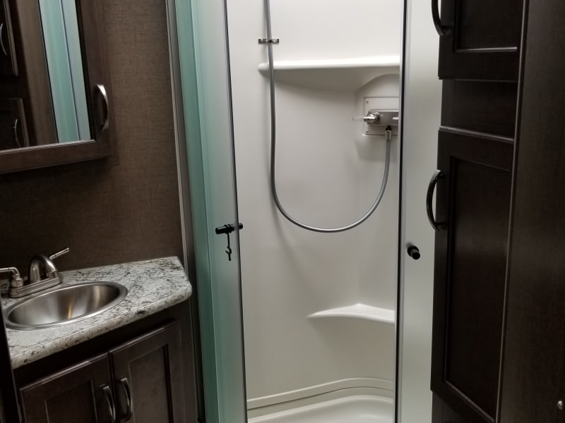 full size shower with glass doors