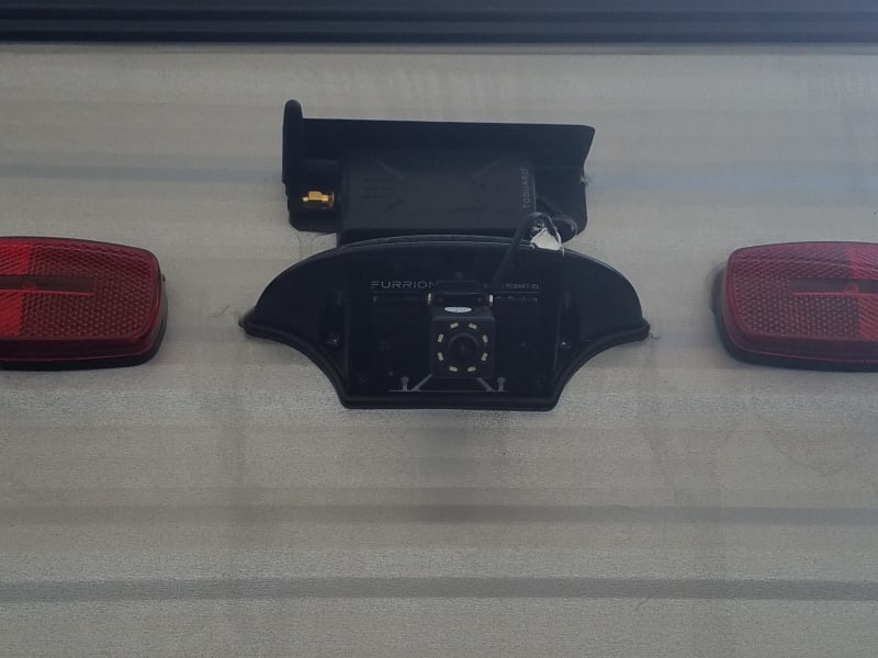 Wireless rear view camera.  So you can see behind you while driving and backing.  Receiver/monitor plugs into any cigarette lighter type 12v connection.  
