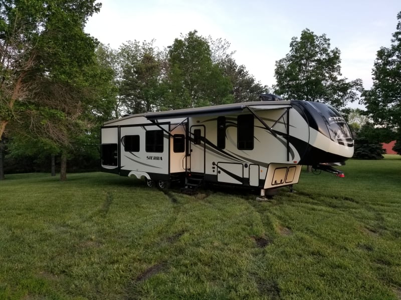 Exterior with 2 slides and awning out.