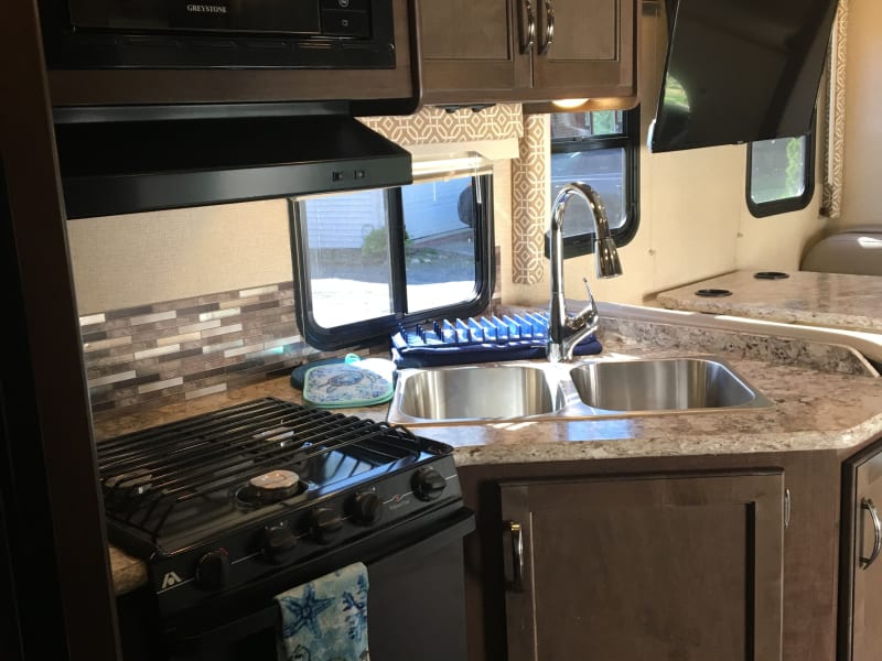 Kitchen: oven, range, microwave, double sink