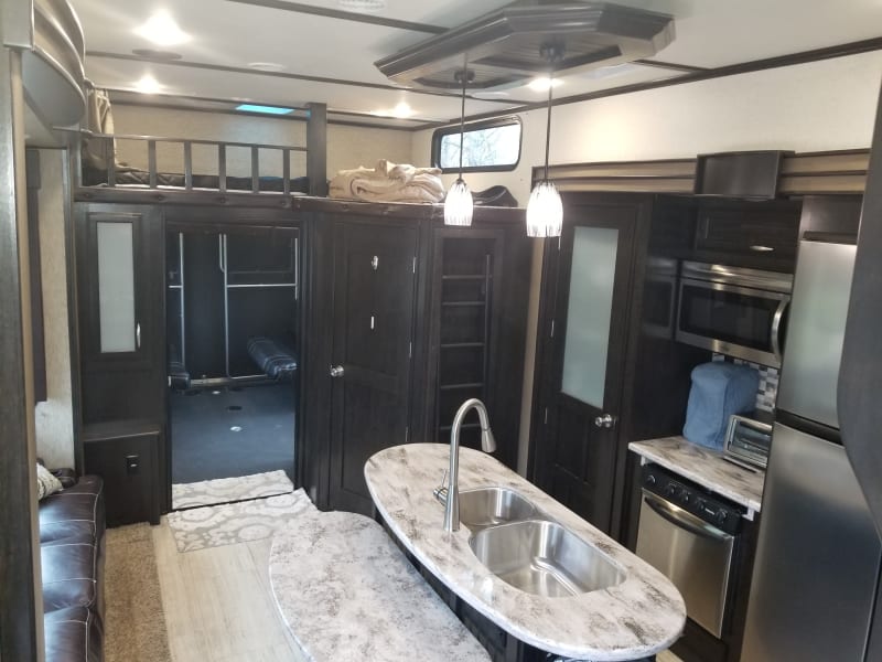 Living room, Kitchen, pantry, loft bed for smaller children.
