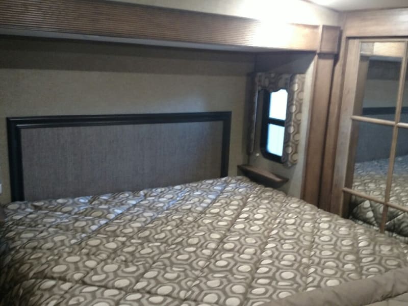 King size bed with full closet and drawer storage